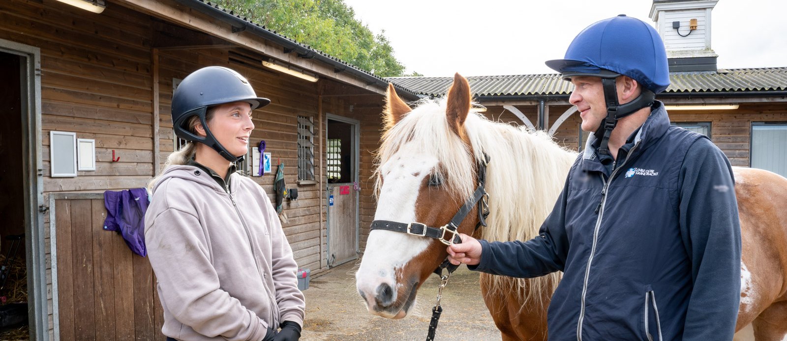 Malcolm Morley, vet, having a conversation with a client